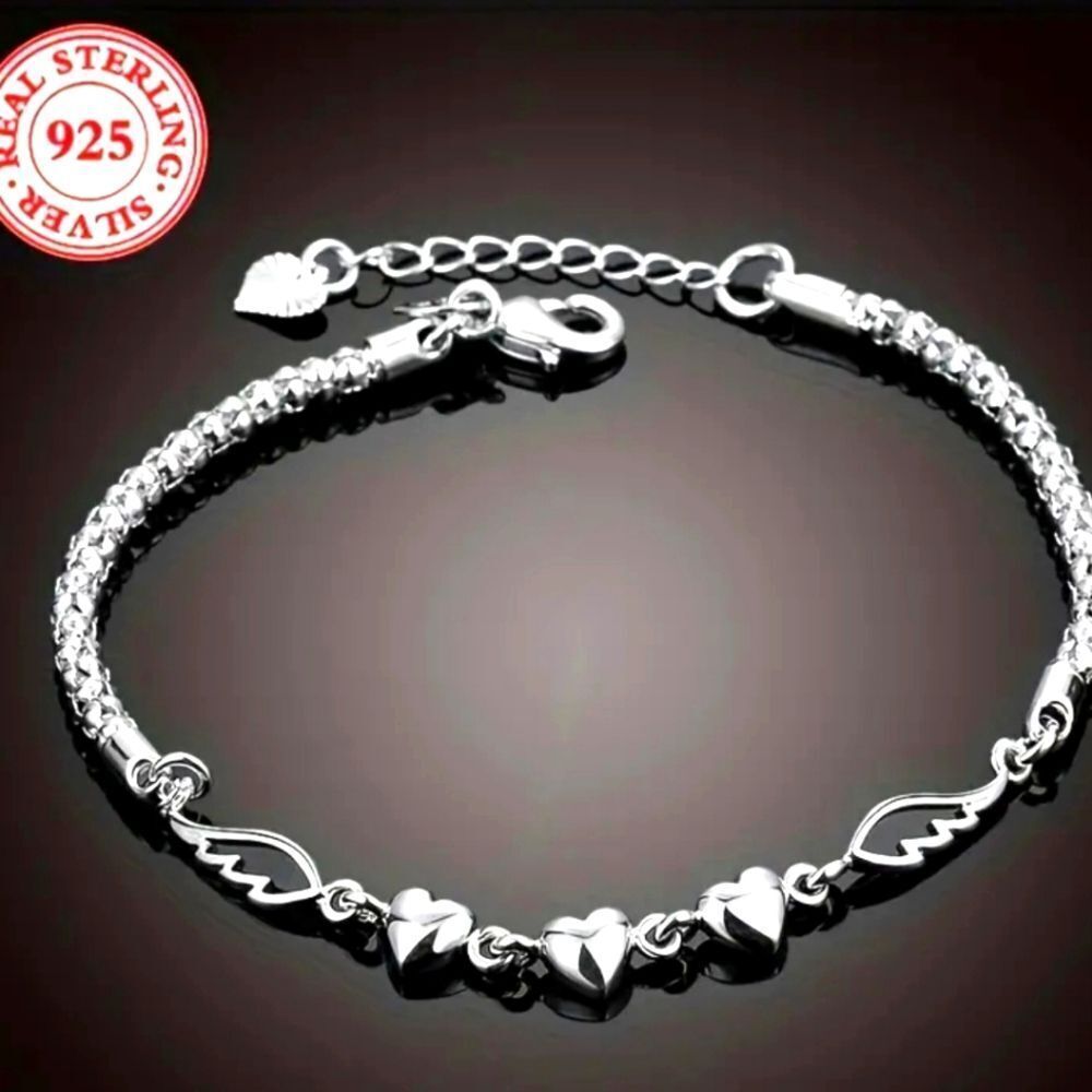 Ladies Elegant 925 sterling silver charm bracelet.